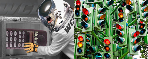 photo montage, scientist building a two foot or 60 cm long mobile phone, bank of around 50 clustered traffic lights